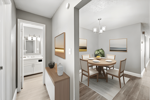 a living room and a dining room with a table and chairs